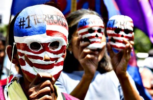 Filipinos protest outside the US embassy in Manila...epa04157580 Filipino activists hold paper mache skulls painted with US flags as they march outside the US embassy in Manila, Philippines, 07 April 2014 in a rally condemning the upcoming visit of US President Barack Obama to the country. Activists also called for an end to the presence of US troops in the country and the Visiting Forces Agreement (VFA). Obama is set to visit Japan, South Korea, Malaysia and the Philippines in late April. The trip is part of his efforts to broaden US engagement in the Asia-Pacific region on all fronts, from strategic security issues to trade and diplomacy. EPA/DENNIS M. SABANGAN